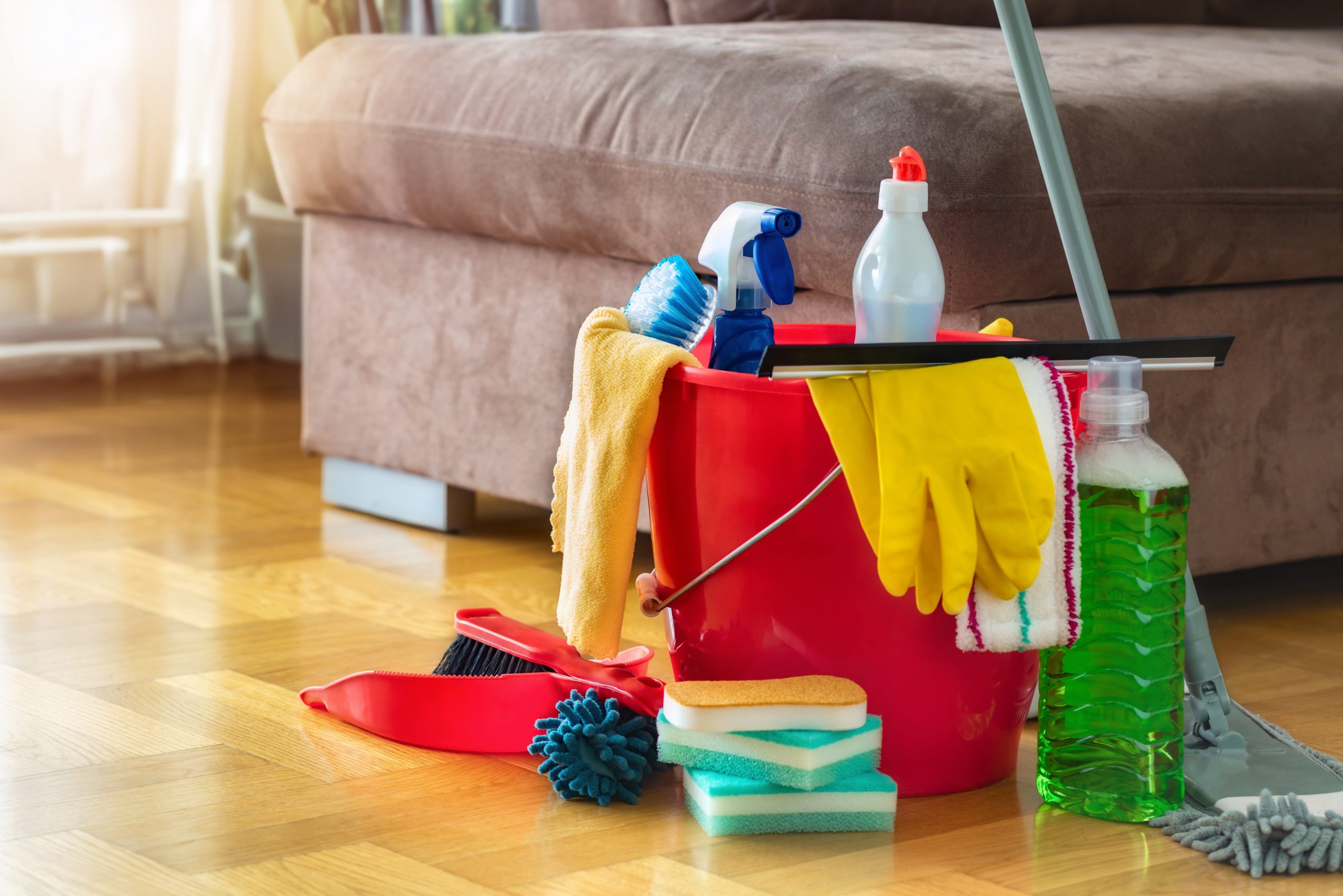 Cleaning kit on an oak herringbone parquet hardwood floor after Wood Floor Sanding in Rainham, showing how to maintain freshly restored timber.