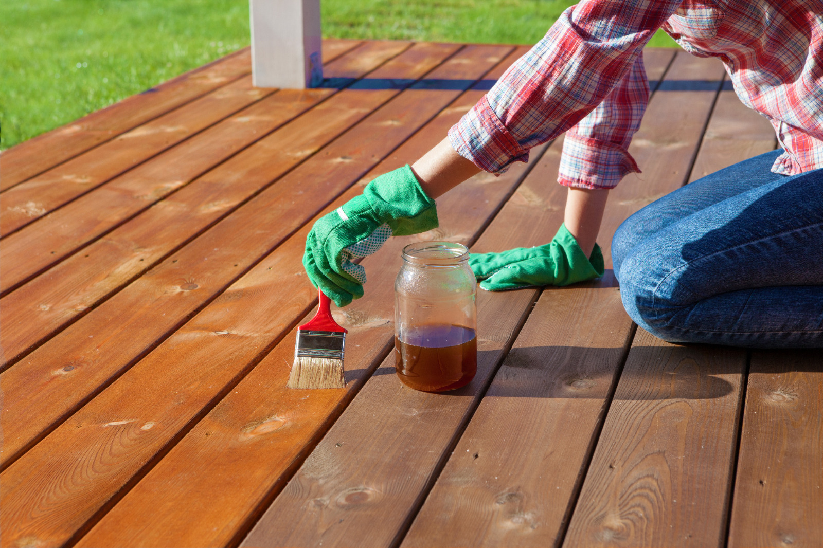 Deck Sanding in Rainham – softwood garden deck boards freshly sanded and being oiled for a rich, weather-resistant finish.