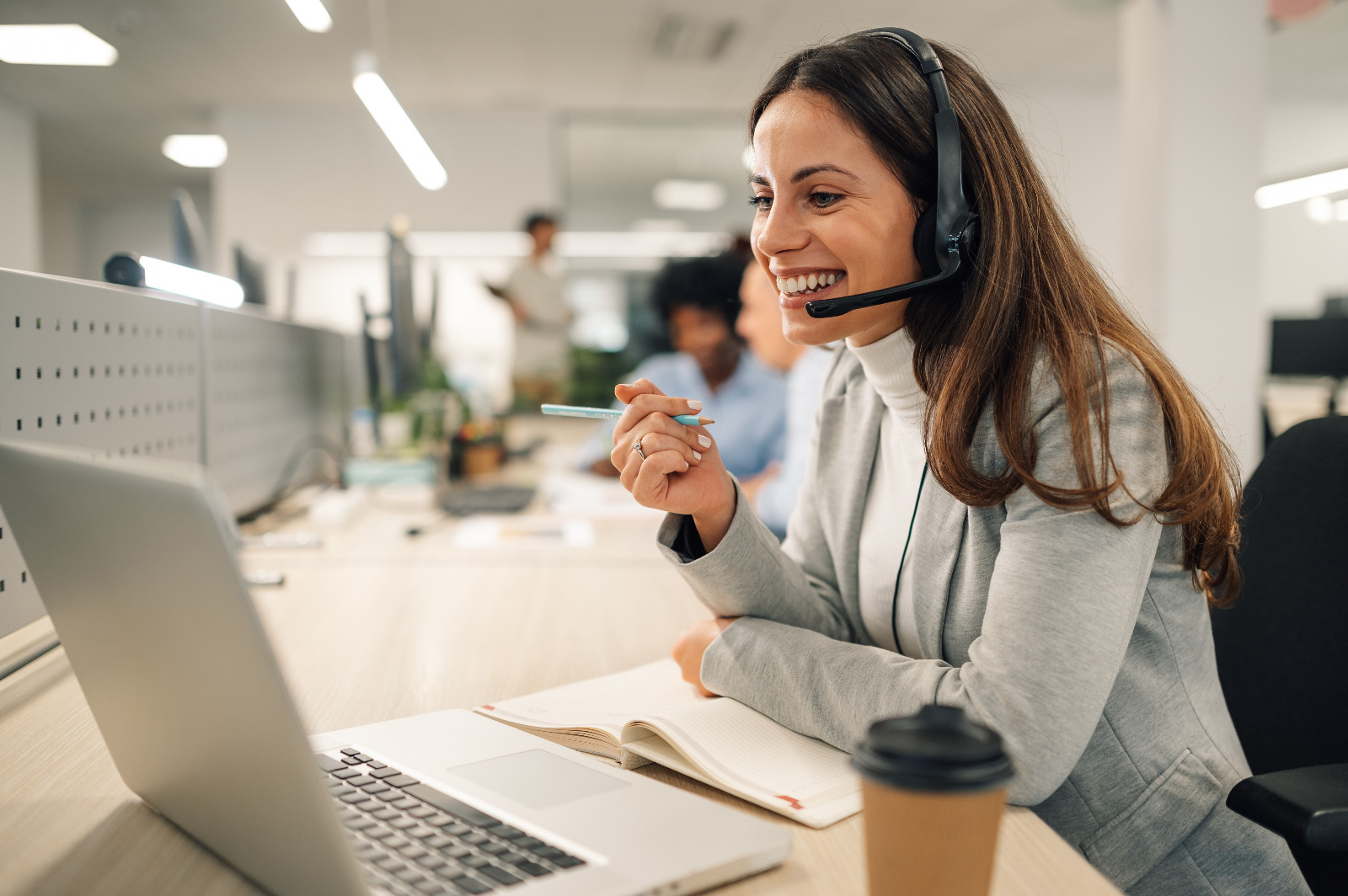 Commercial Floor Sanding in Rainham – office customer support team in a modern workspace with oak parquet wood office flooring, highlighting professional services for busy businesses.